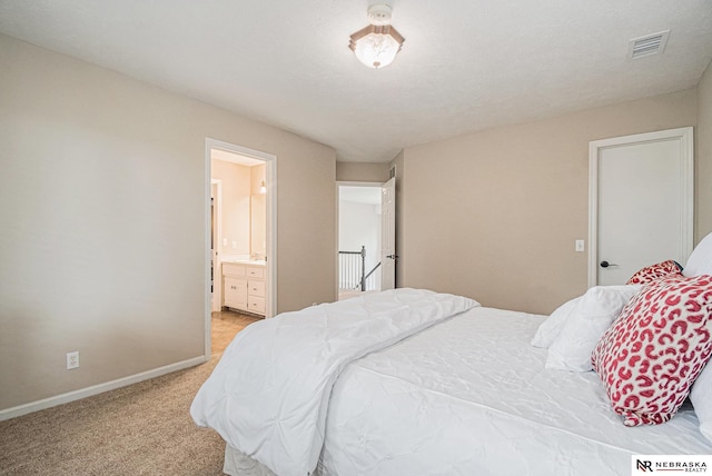 2221 S 181st Cir, Omaha, NE 68130 - bedroom with light carpet and ensuite bathroom