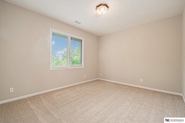 2221 S 181st Cir, Omaha, NE 68130 - spare room featuring carpet and baseboards