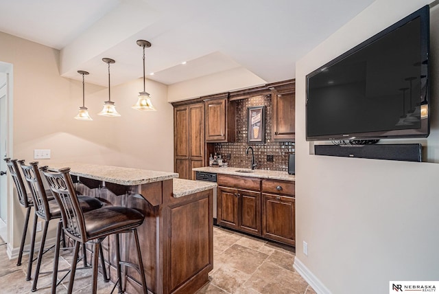 2221 S 181st Cir, Omaha, NE 68130 - indoor bar featuring decorative backsplash, hanging light fixtures, light stone finish floors, dishwasher, and recessed lighting