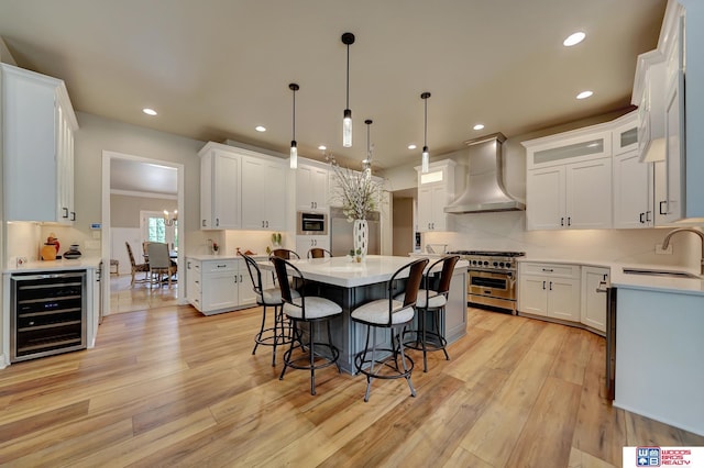 6602 Pheasant Run Pl, Lincoln, NE 68516 - kitchen featuring custom range hood, beverage cooler, appliances with stainless steel finishes, a sink, and a kitchen bar