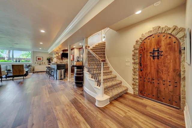 6602 Pheasant Run Pl, Lincoln, NE 68516 - entryway with wood finished floors, ornamental molding, stairway, recessed lighting, and baseboards