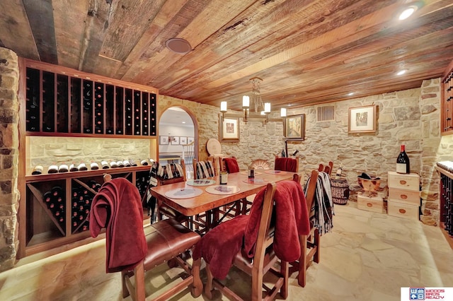 6602 Pheasant Run Pl, Lincoln, NE 68516 - wine cellar featuring wood ceiling, a chandelier, and arched walkways