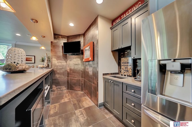 6602 Pheasant Run Pl, Lincoln, NE 68516 - kitchen with stainless steel fridge with ice dispenser, a sink, light countertops, gray cabinetry, and recessed lighting