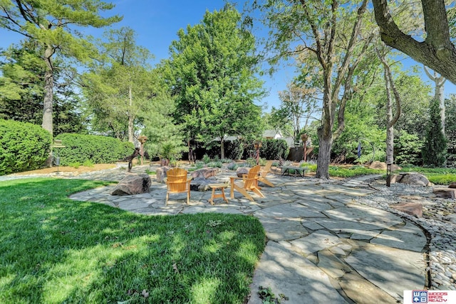 6602 Pheasant Run Pl, Lincoln, NE 68516 - view of patio / terrace with view of wooded area