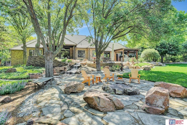 6602 Pheasant Run Pl, Lincoln, NE 68516 - view of patio featuring an outdoor fire pit