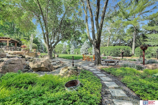 6602 Pheasant Run Pl, Lincoln, NE 68516 - view of yard with an outdoor fire pit and view of wooded area