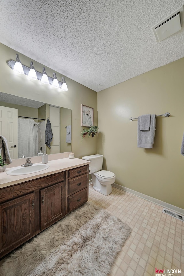 430 N 86th St, Lincoln, NE 68505 - full bath with toilet, vanity, a shower with shower curtain, baseboards, and a textured ceiling