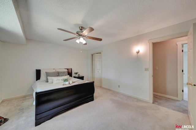 430 N 86th St, Lincoln, NE 68505 - bedroom featuring light colored carpet, a textured ceiling, a ceiling fan, and baseboards
