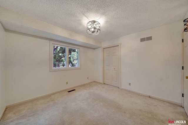430 N 86th St, Lincoln, NE 68505 - unfurnished room with light colored carpet, a textured ceiling, and baseboards
