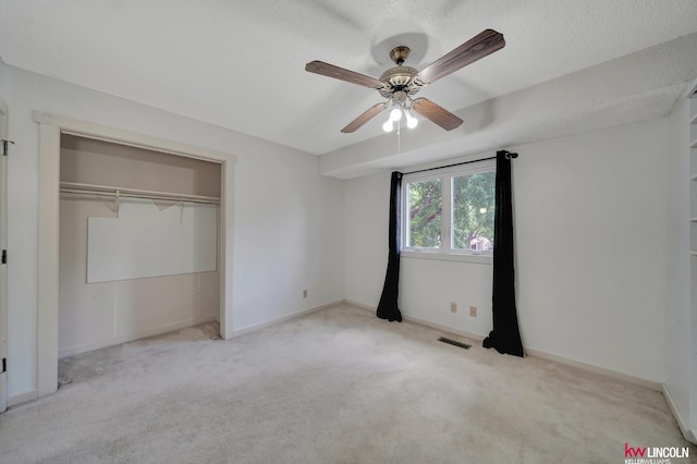 430 N 86th St, Lincoln, NE 68505 - unfurnished bedroom featuring carpet floors, a closet, a ceiling fan, baseboards, and a textured ceiling