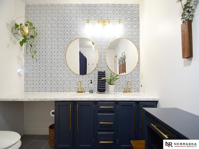 4219 Browning St, Lincoln, NE 68516 - bathroom featuring double vanity, tile patterned flooring, toilet, and tasteful backsplash