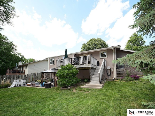 4219 Browning St, Lincoln, NE 68516 - back of property with a gazebo, stairway, and a deck