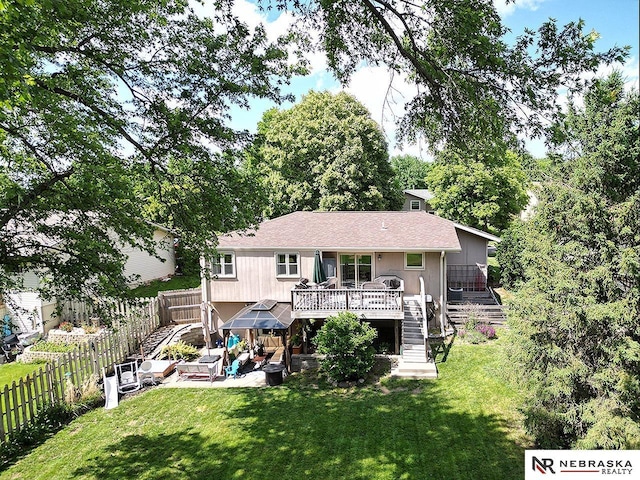 4219 Browning St, Lincoln, NE 68516 - rear view of property featuring a patio area, a wooden deck, stairs, and a shingled roof