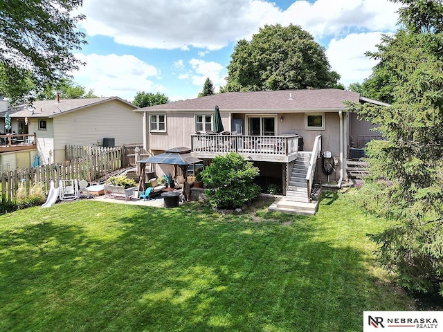 4219 Browning St, Lincoln, NE 68516 - rear view of property with a deck and stairs