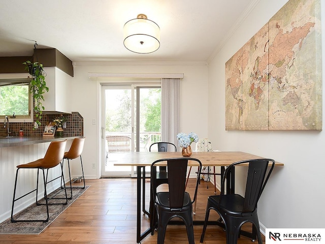 4219 Browning St, Lincoln, NE 68516 - dining room with ornamental molding, wood finished floors, and baseboards