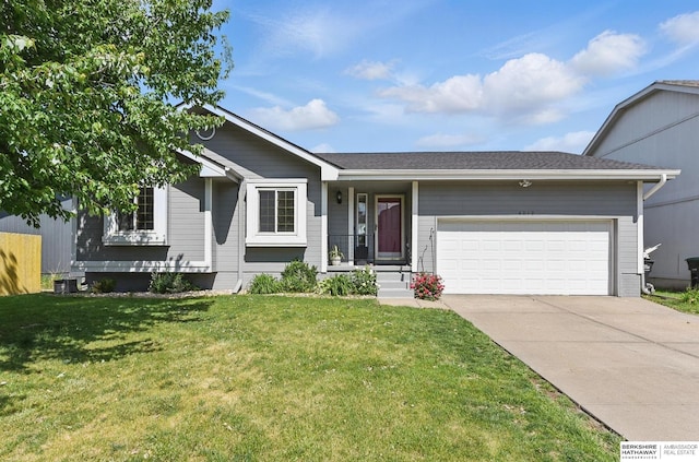 4019 N 147th St, Omaha, NE 68116 - ranch-style house with an attached garage, concrete driveway, a front yard, and central air condition unit