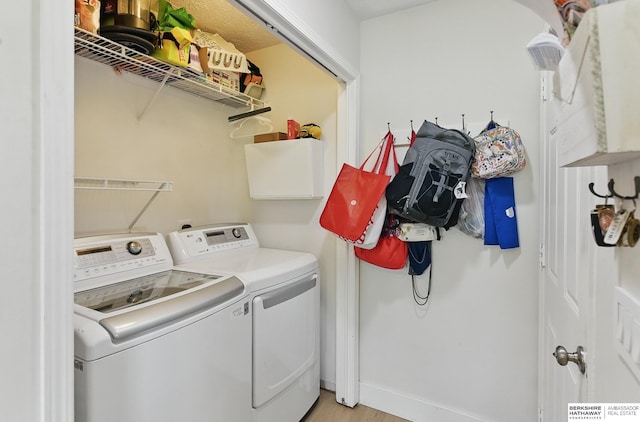 4019 N 147th St, Omaha, NE 68116 - laundry area featuring washing machine and clothes dryer and light wood-style flooring