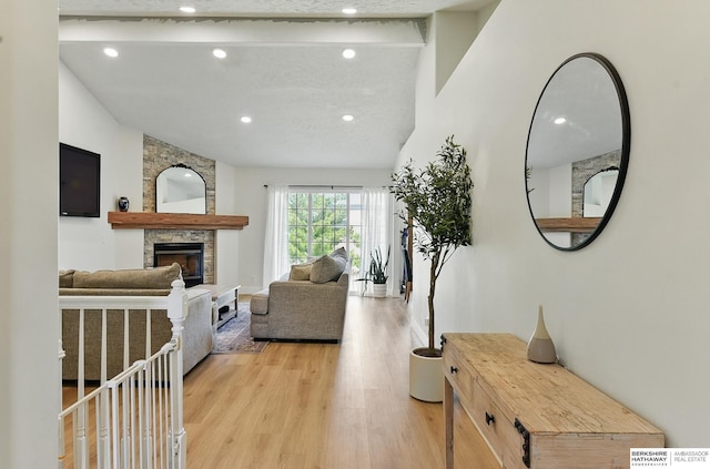 4019 N 147th St, Omaha, NE 68116 - living area with a fireplace, recessed lighting, light wood-type flooring, and vaulted ceiling