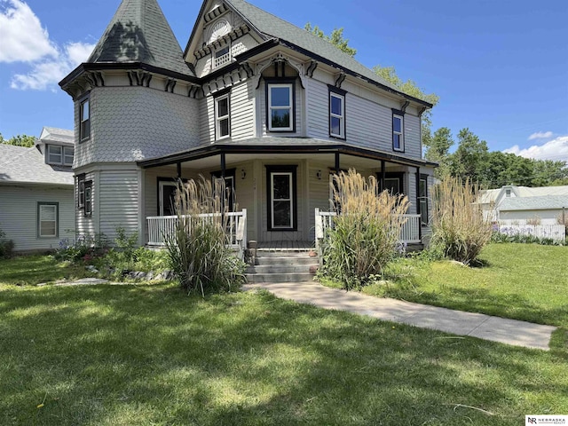 204 E York Ave, Dewitt, NE 68341 - view of front facade with covered porch, a front yard, and roof with shingles
