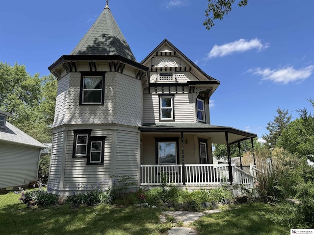 204 E York Ave, Dewitt, NE 68341 - victorian home featuring covered porch and a front lawn