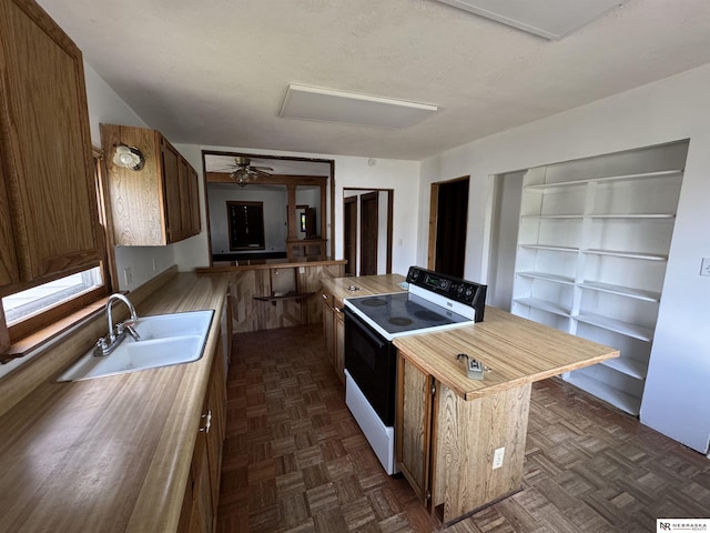 204 E York Ave, Dewitt, NE 68341 - kitchen with white electric stove, a sink, and a ceiling fan