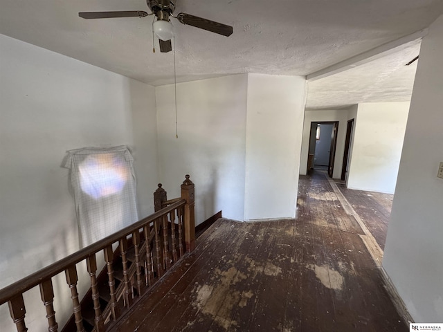 204 E York Ave, Dewitt, NE 68341 - hallway with hardwood / wood-style flooring, an upstairs landing, and a textured ceiling