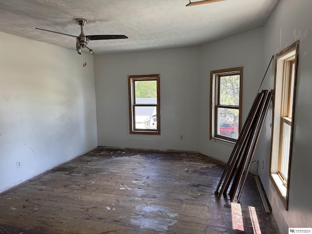 204 E York Ave, Dewitt, NE 68341 - spare room with hardwood / wood-style floors, a ceiling fan, and a textured ceiling
