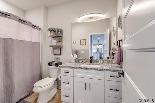 18403 Greenleaf St, Omaha, NE 68136 - bathroom featuring vanity, wood finished floors, toilet, and a shower with shower curtain