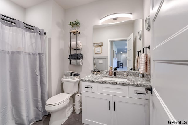 18403 Greenleaf St, Omaha, NE 68136 - bathroom featuring vanity, toilet, tile patterned flooring, and curtained shower