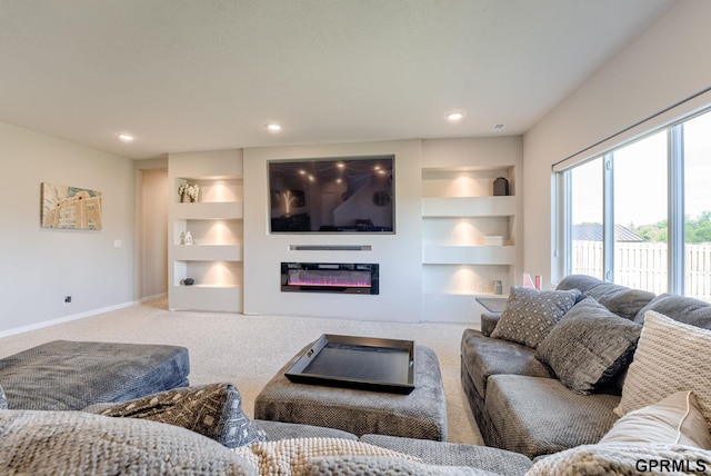 18403 Greenleaf St, Omaha, NE 68136 - carpeted living room featuring built in features, baseboards, a glass covered fireplace, and recessed lighting