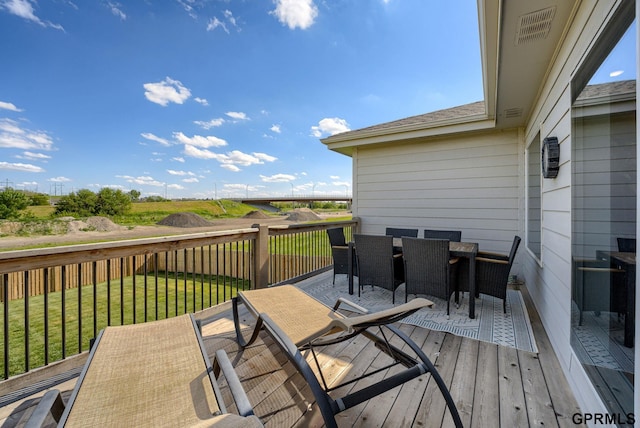 18403 Greenleaf St, Omaha, NE 68136 - wooden terrace with outdoor dining area and a yard