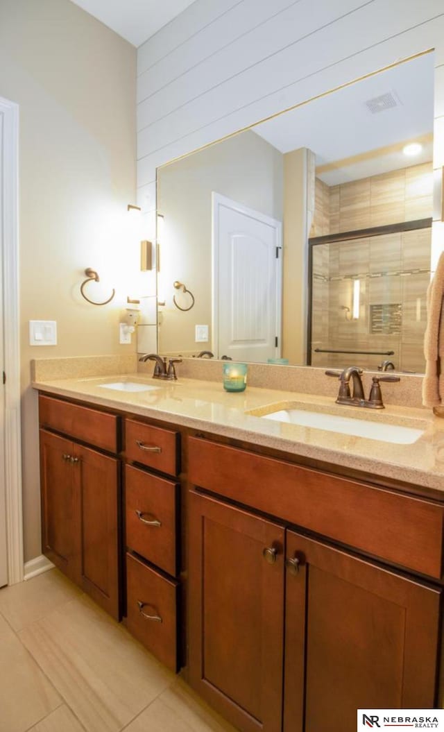 10425 S 110th St, Papillion, NE 68046 - bathroom featuring double vanity, a stall shower, and tile patterned floors