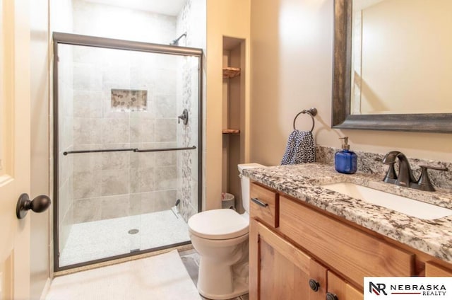 10425 S 110th St, Papillion, NE 68046 - bathroom with toilet, vanity, and a stall shower
