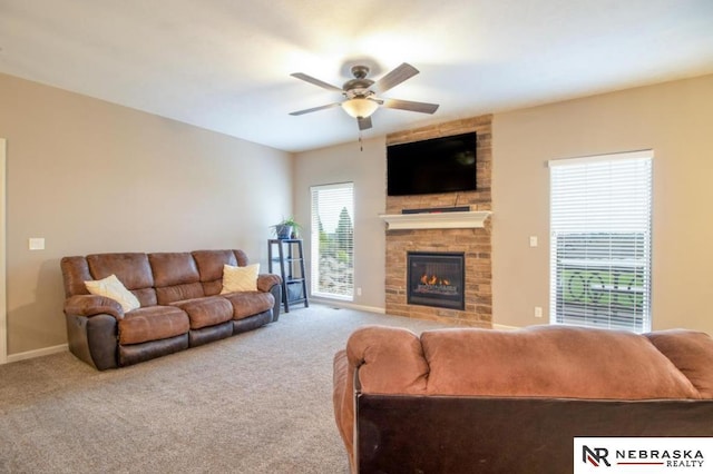 10425 S 110th St, Papillion, NE 68046 - living room featuring a ceiling fan, a fireplace, carpet flooring, and baseboards