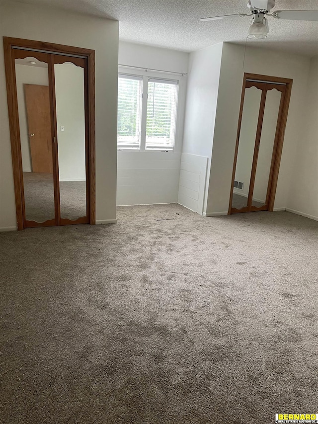 608 N 16th St, Nebraska City, NE 68410 - empty room with a textured ceiling, carpet, and ceiling fan