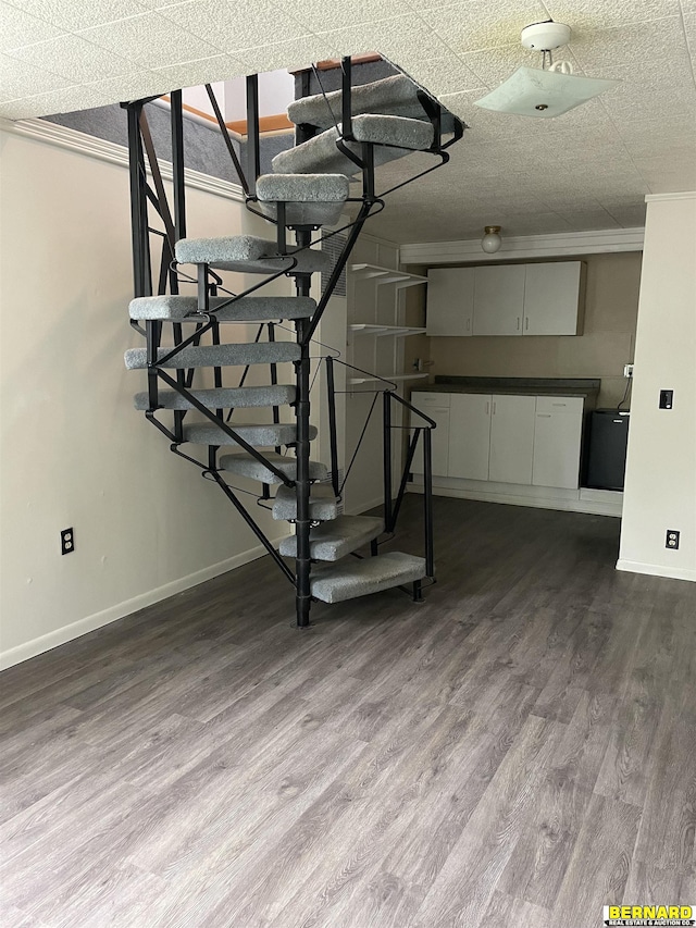 608 N 16th St, Nebraska City, NE 68410 - basement with baseboards, dark wood-type flooring, and stairs