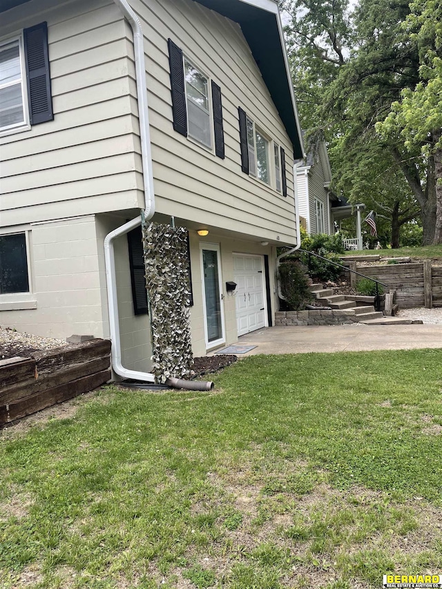 608 N 16th St, Nebraska City, NE 68410 - view of side of property featuring an attached garage and a yard