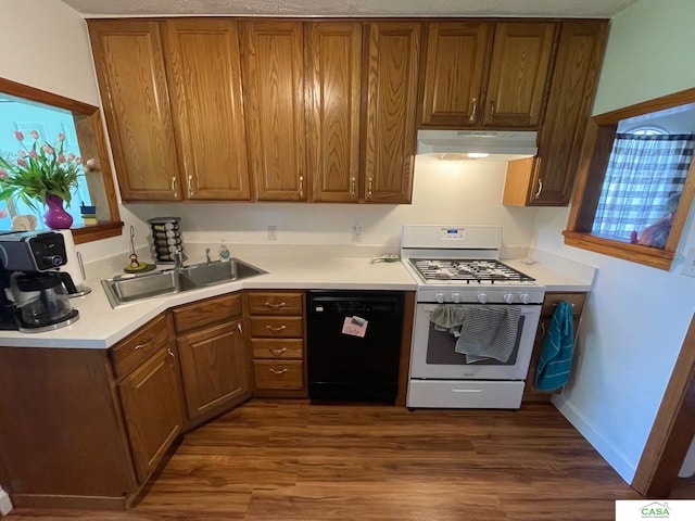 5427 W Hughes St, Lincoln, NE 68524 - kitchen featuring dishwasher, gas range gas stove, under cabinet range hood, and dark wood-style flooring