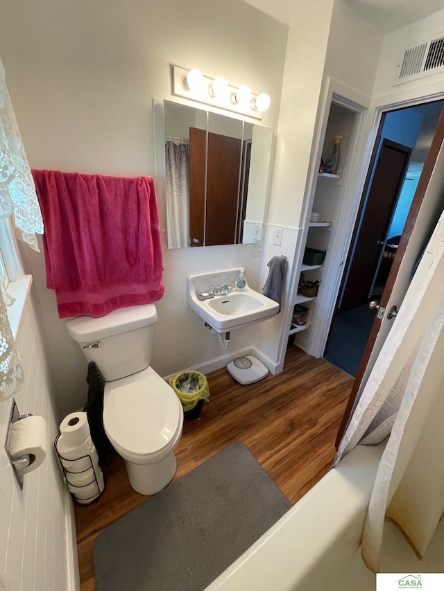 5427 W Hughes St, Lincoln, NE 68524 - full bath with wood finished floors, a sink, and toilet