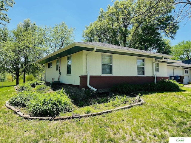 5427 W Hughes St, Lincoln, NE 68524 - view of home's exterior featuring a lawn