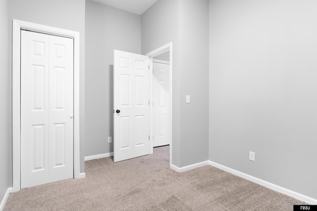 1204 S 27th St, Omaha, NE 68105 - unfurnished bedroom with carpet flooring, baseboards, and a closet