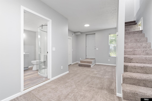 1204 S 27th St, Omaha, NE 68105 - foyer entrance with stairway, carpet, and baseboards