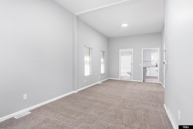 1204 S 27th St, Omaha, NE 68105 - carpeted empty room featuring baseboards