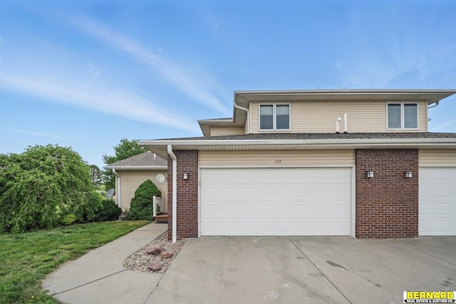 5665 I Rd, Nebraska City, NE 68410 - traditional-style home featuring brick siding, a garage, and driveway