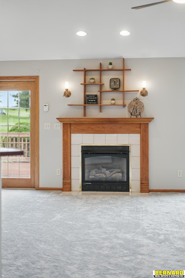 5665 I Rd, Nebraska City, NE 68410 - detailed view of carpet floors, a tiled fireplace, baseboards, and recessed lighting
