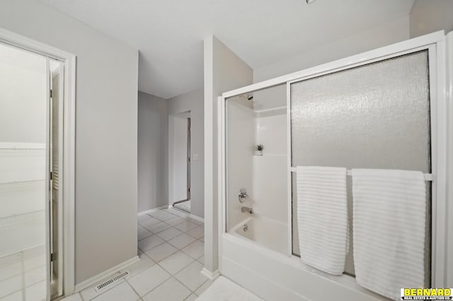 5665 I Rd, Nebraska City, NE 68410 - full bathroom featuring tile patterned floors, washtub / shower combination, and baseboards