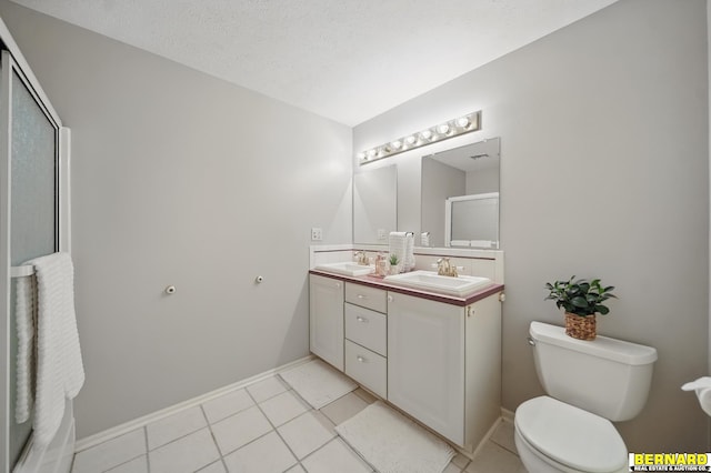 5665 I Rd, Nebraska City, NE 68410 - full bathroom with double vanity, tile patterned floors, toilet, baseboards, and an enclosed shower