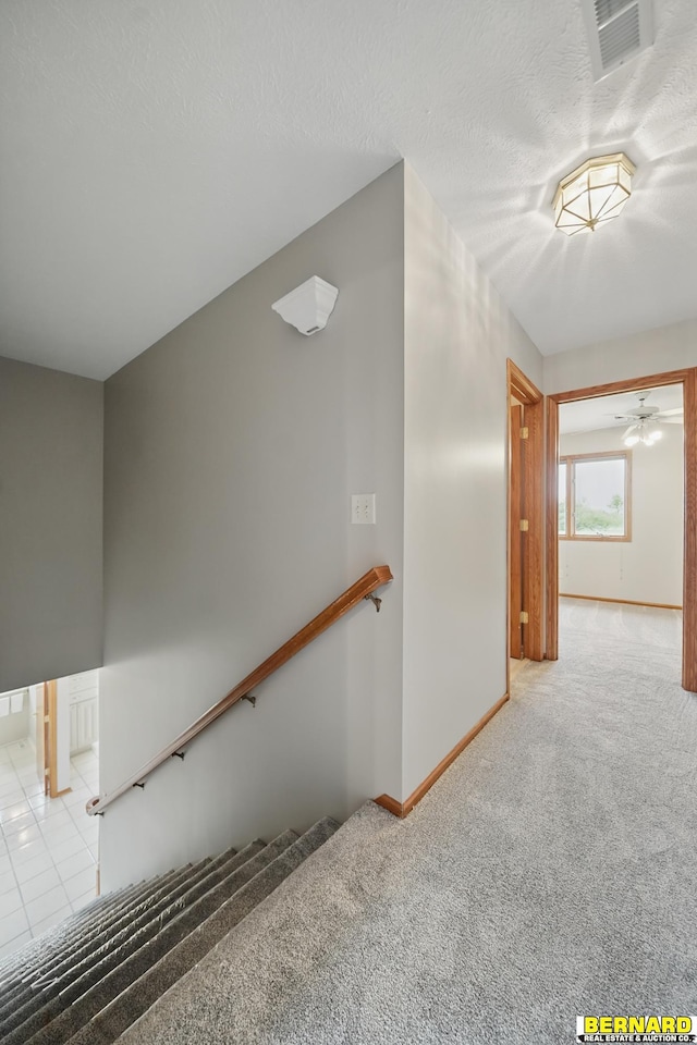 5665 I Rd, Nebraska City, NE 68410 - stairway featuring carpet, baseboards, and a ceiling fan
