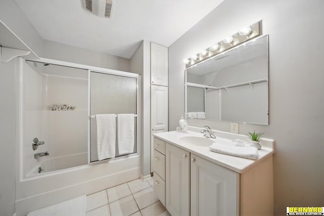 5665 I Rd, Nebraska City, NE 68410 - bathroom with tile patterned floors, vanity, and enclosed tub / shower combo