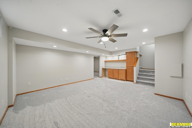 5665 I Rd, Nebraska City, NE 68410 - unfurnished living room featuring light colored carpet, baseboards, recessed lighting, a ceiling fan, and stairway